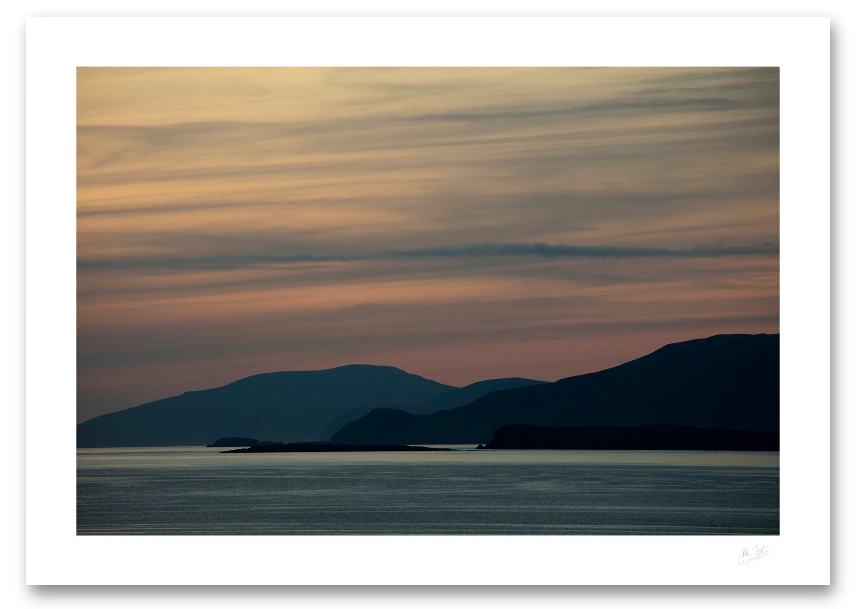 an unframed print of Clare and Achill Islands silhouetted in front of a palette of twilight colour, avalable to buy online