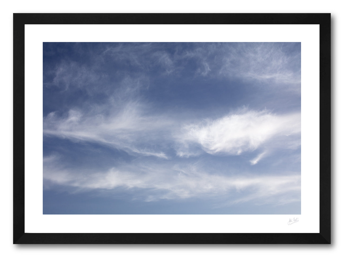 a framed fine art photographic print of the sky and clouds above Dooey Beach in Donegal resembling the familiar pattern of the Great Red Spot on Jupiter