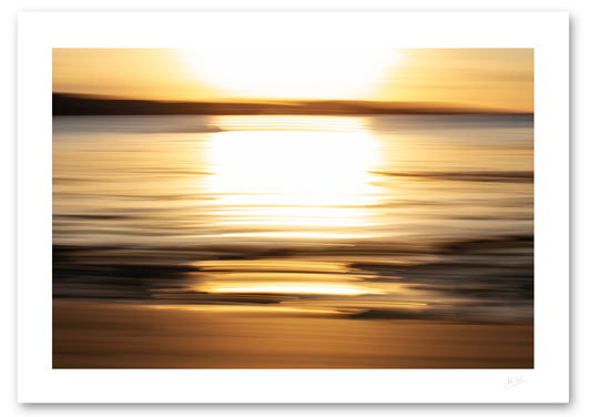a fine art photographic print of the wonderful golden light of a setting sun across Cleggan Bay in Connemara