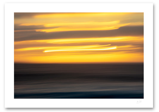an unframed fine art photograph using intentional camera movement of a sunset in el Golfo in Lanzarote