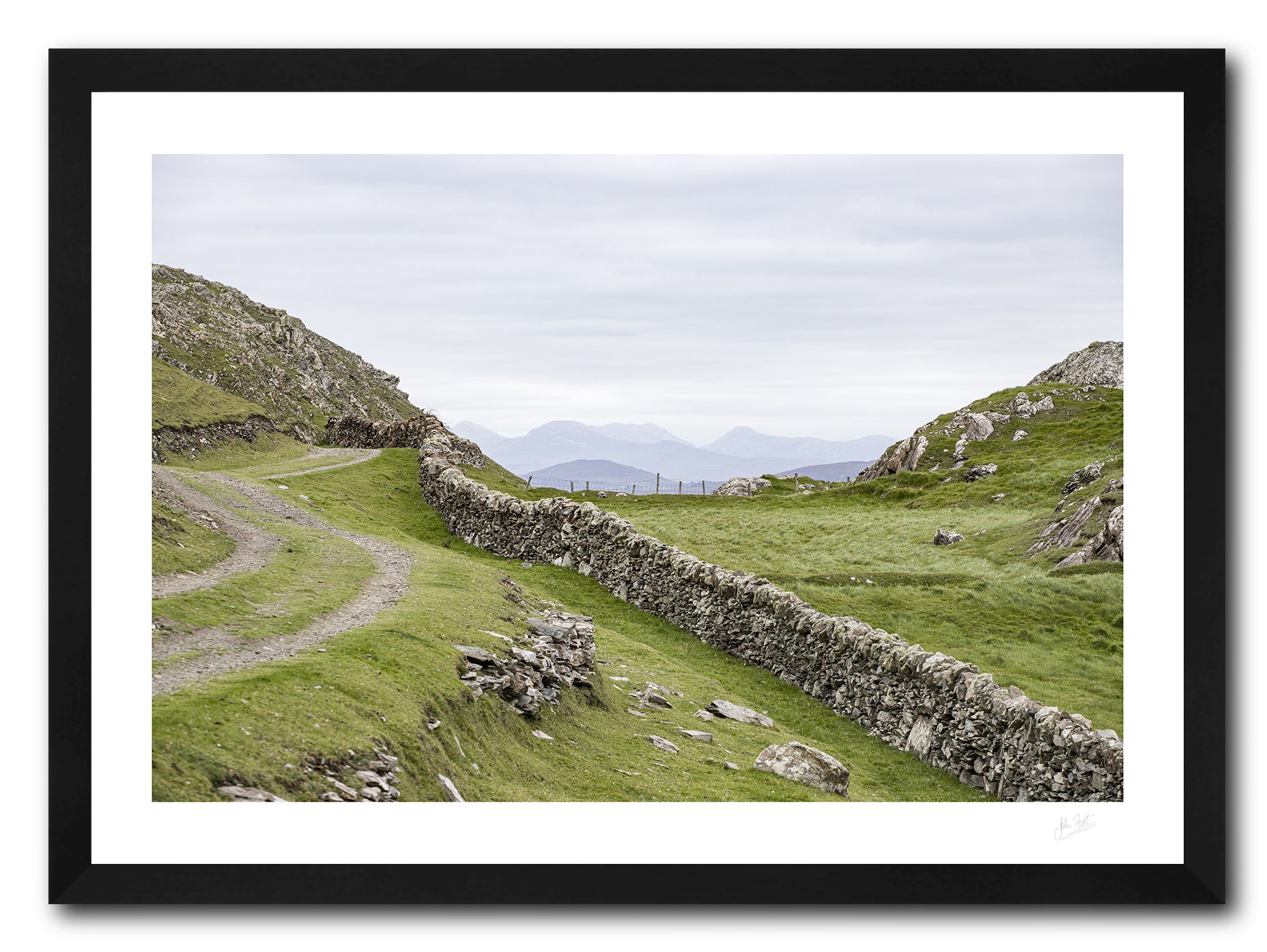a framed fine art photographic print of the 12 Bens mountain range as seen from Inishboffin Island, available to buy online