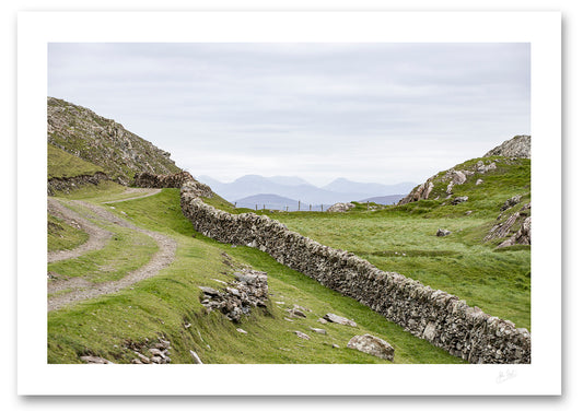an unframed fine art photographic print of the 12 Bens mountain range as seen from Inishboffin Island, available to buy online
