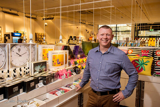 A smiling Peter standing in the middle of his Tiger Store