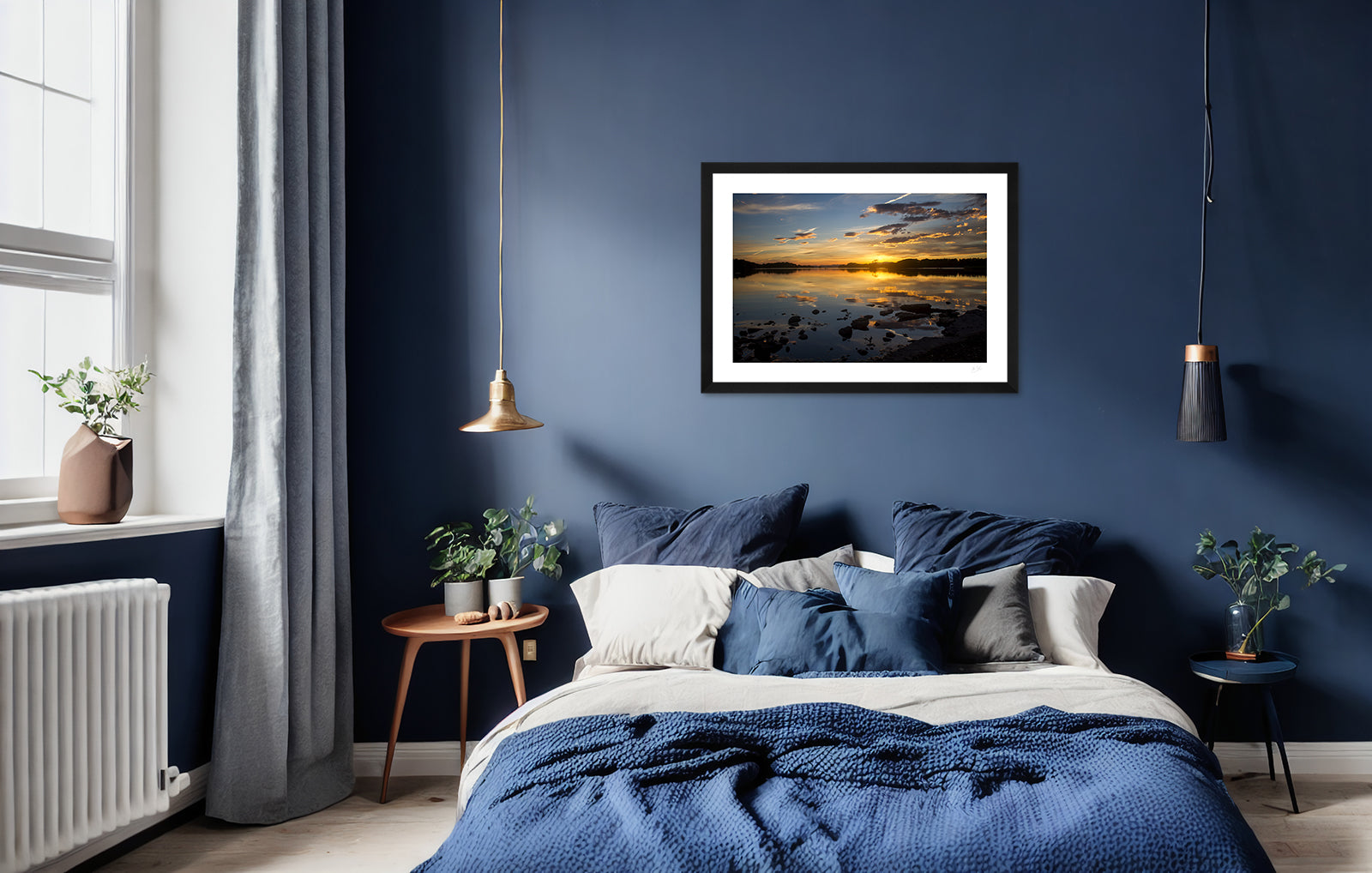 a framed fine art photogrphic print of the beautiful colours of a sunset on Lough Leane, Killarney National Park, hanging on a wall above a bed