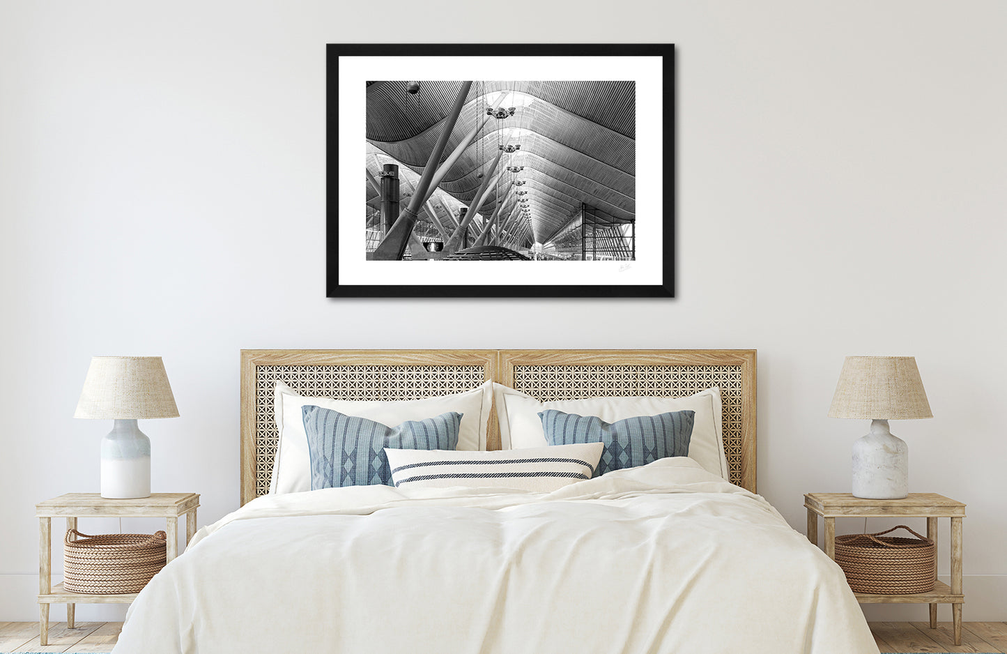 a framed fine art photographic print of the award winning roof of terminal 4 at Madrid Barajas Airport, hanging on a wall above a bed