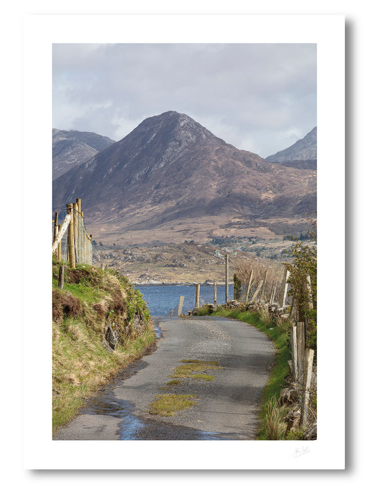 fine art photograph a rough and winding narrow country road leads to eye across Ballynakill Bay to Diamond Hill of the 12 Bens 