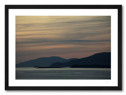 a framed print of Clare and Achill Islands silhouetted in front of a palette of twilight colour, avalable to buy online