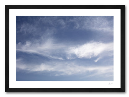a framed fine art photographic print of the sky and clouds above Dooey Beach in Donegal resembling the familiar pattern of the Great Red Spot on Jupiter