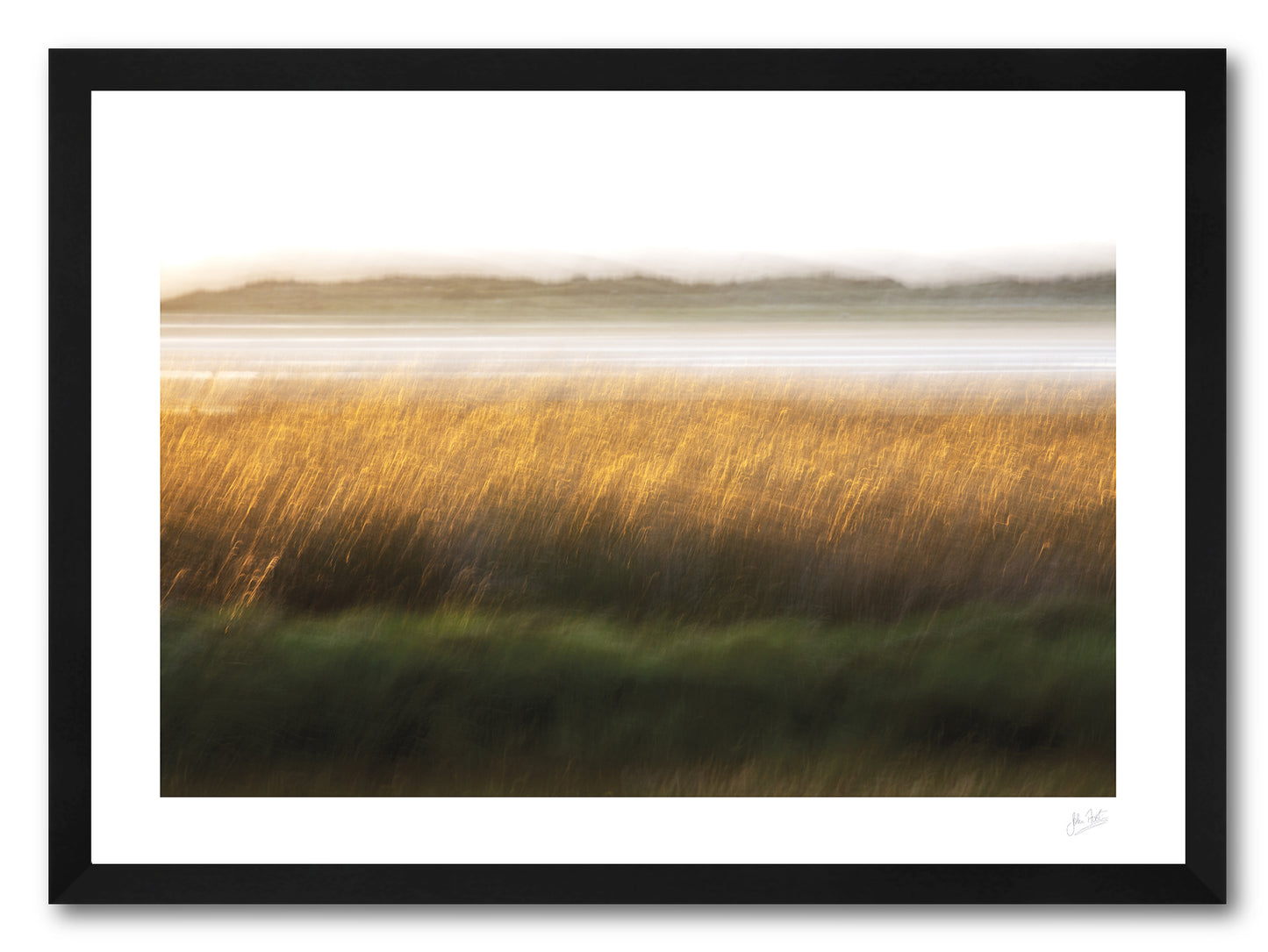 a framed fine art photogrphic print of a field of tall grass becomes a field of gold in the setting sun using motion blur along the shore of Loughros Beg Bay in Donegal.