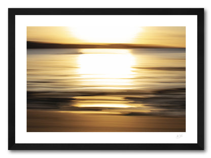 a framed fine art photographic print of the wonderful golden light of a setting sun across Cleggan Bay in Connemara