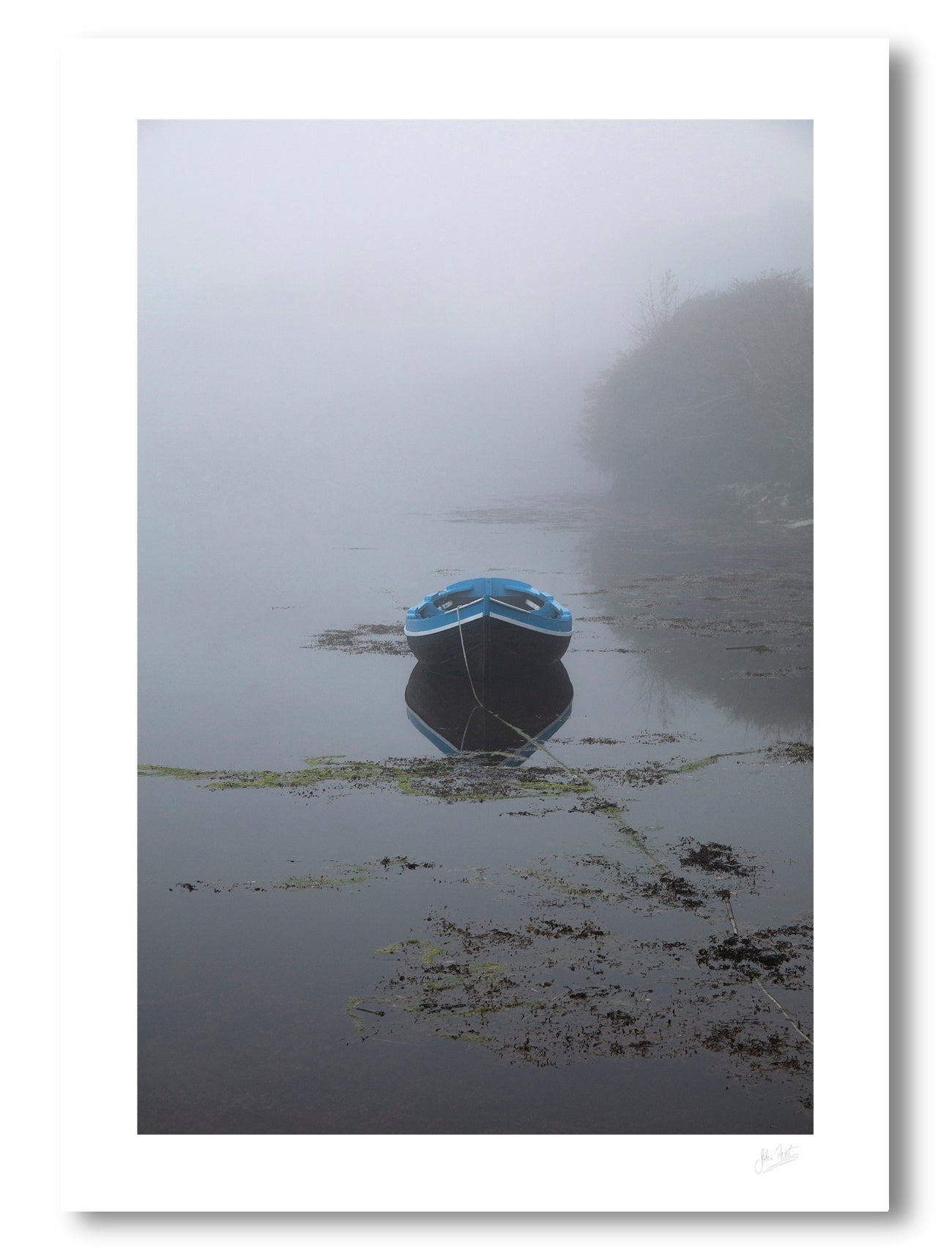 scene in the coastal fishing town of Roundstone, Connemara, with a boat and harbour shrouded in a dense fog
