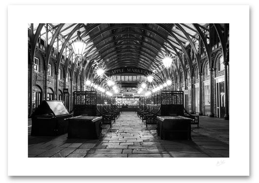 unframed fine art print of Apple Market in Covent Garden, London after the market has closed in black and white