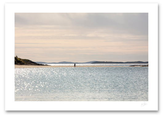 unframed print of a woman stolling along Glassilaun Beach in summer