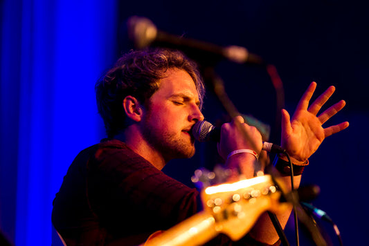 Lead singer of music group Seo Linn performing on stage at the Dublin Convention Centre