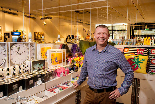 A smiling Peter standing in the middle of his Tiger Store 