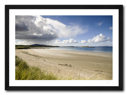 a framed fine art photographic print of rain heading to Glassilaun Beach, Connemara on a sunny autumn afternoon, available to buy online
