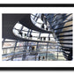 a framed fine art photographic print of the inside of the Reichstag Dome in Berlin, Germany with visitors looking out at the city skyline, available to buy online
