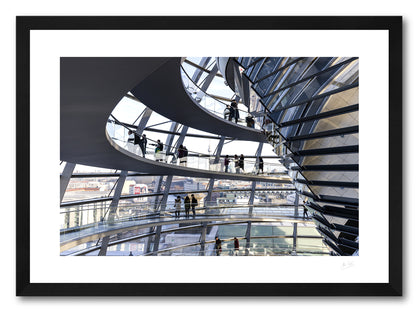 a framed fine art photographic print of the inside of the Reichstag Dome in Berlin, Germany with visitors looking out at the city skyline, available to buy online