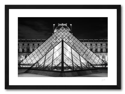 a framed black and white fine art photoraphic print of the old and the new facades of the Louvre museum lined up in perfect symmetry, available to buy online