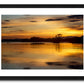 a framed fine art photographic print of a boat of rowers on Lough Leane, Killarney surrounded by the beautiful colours of a summer sunset, available to buy online