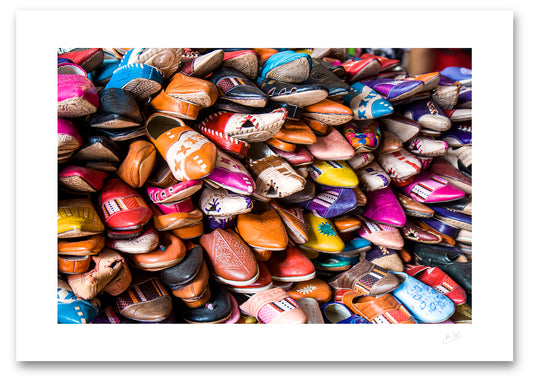 unframed fine art print of a pile of different coloured shoes in Tangier